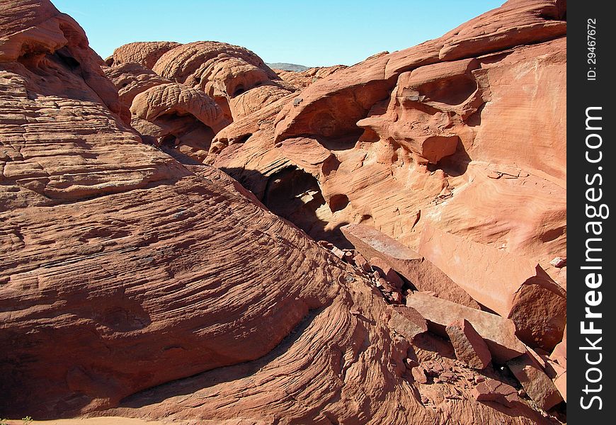 Redstone is on the North Shore Drive in Lake Mead NRA. It is about 40 miles outside of Las Vegas, about 20 miles past the Callville Bay cutoff and about 10 away from the Echo Bay junction. Heavily eroded fossil sand dunes from the Jurassic Period date back 120 million years ago. Redstone is on the North Shore Drive in Lake Mead NRA. It is about 40 miles outside of Las Vegas, about 20 miles past the Callville Bay cutoff and about 10 away from the Echo Bay junction. Heavily eroded fossil sand dunes from the Jurassic Period date back 120 million years ago.