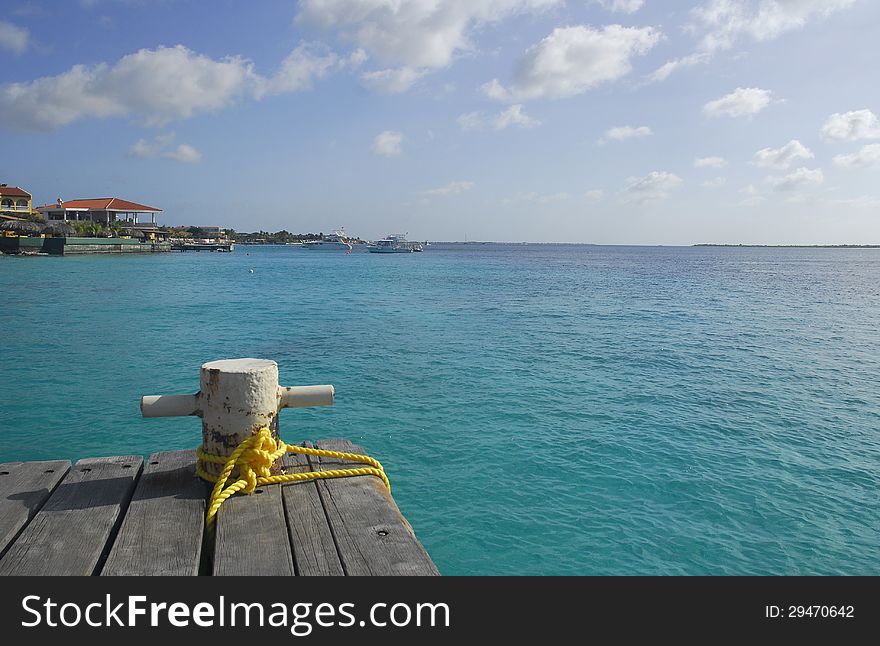 Mooring bollard on a wooden dock in the caribbean.