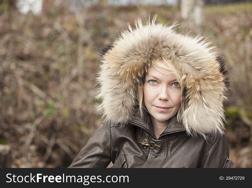 Portrait of a blonde woman in attractive winter coat. Portrait of a blonde woman in attractive winter coat.