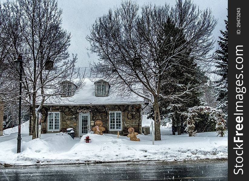 A old stone house turn in to a dairy shop on a snowy day. A old stone house turn in to a dairy shop on a snowy day