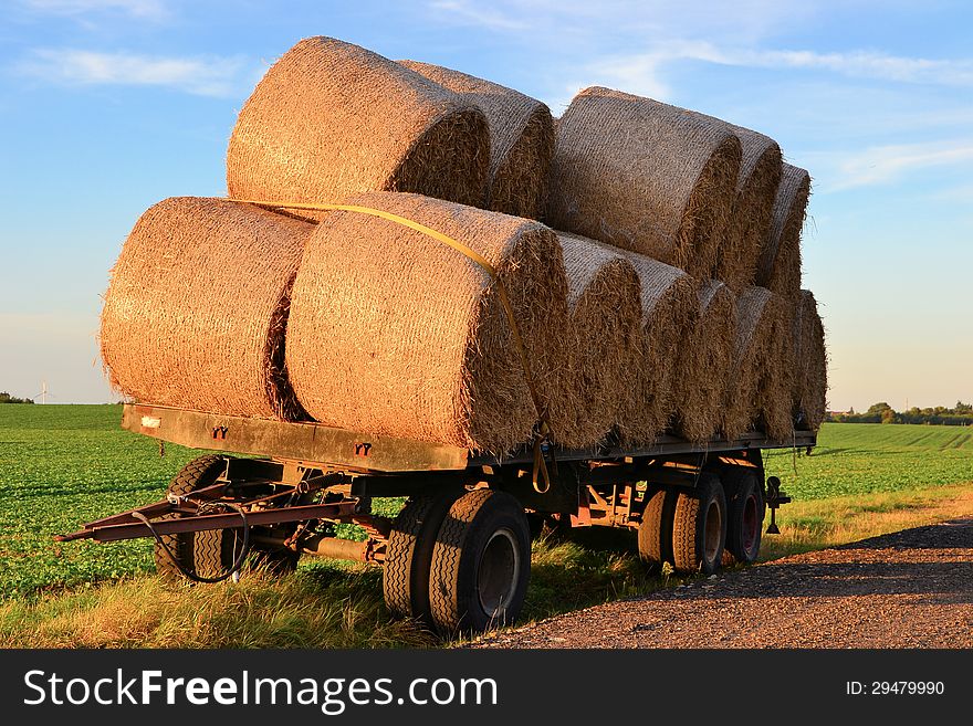 Straw rolls on a trailer at a farm