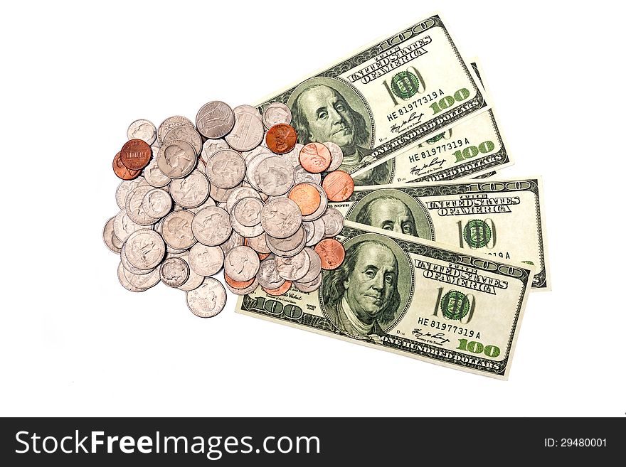 Horizontal shot of shiny coins and hundred dollar bills isolated on a white background. Horizontal shot of shiny coins and hundred dollar bills isolated on a white background.