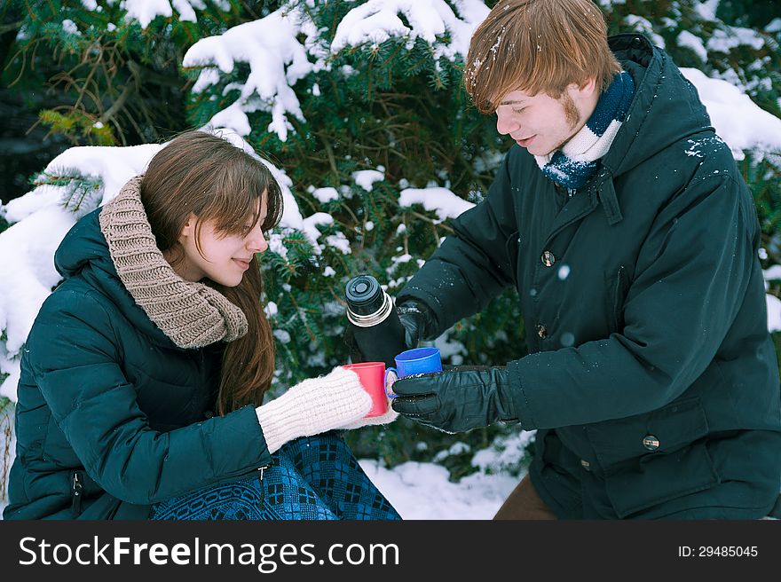 Couple Drinking Tea In Winter