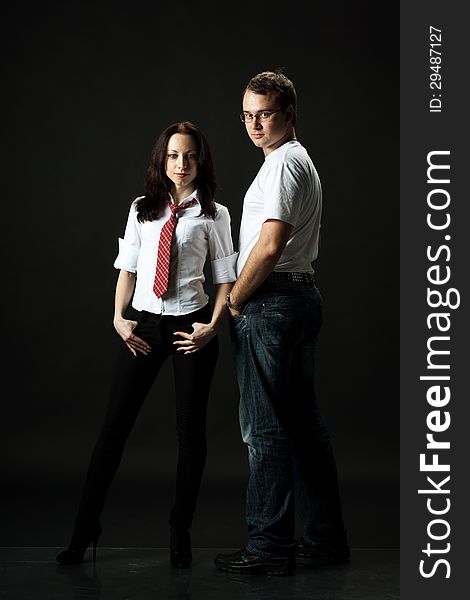 Handsome young couple posing standing in studio. Handsome young couple posing standing in studio