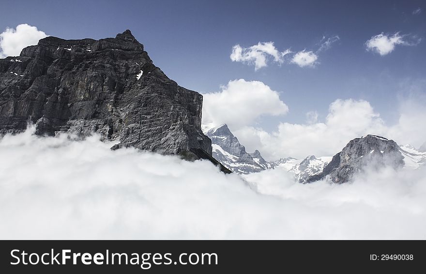 Panoramic view on Swiss Alps during a morning hike. Panoramic view on Swiss Alps during a morning hike.