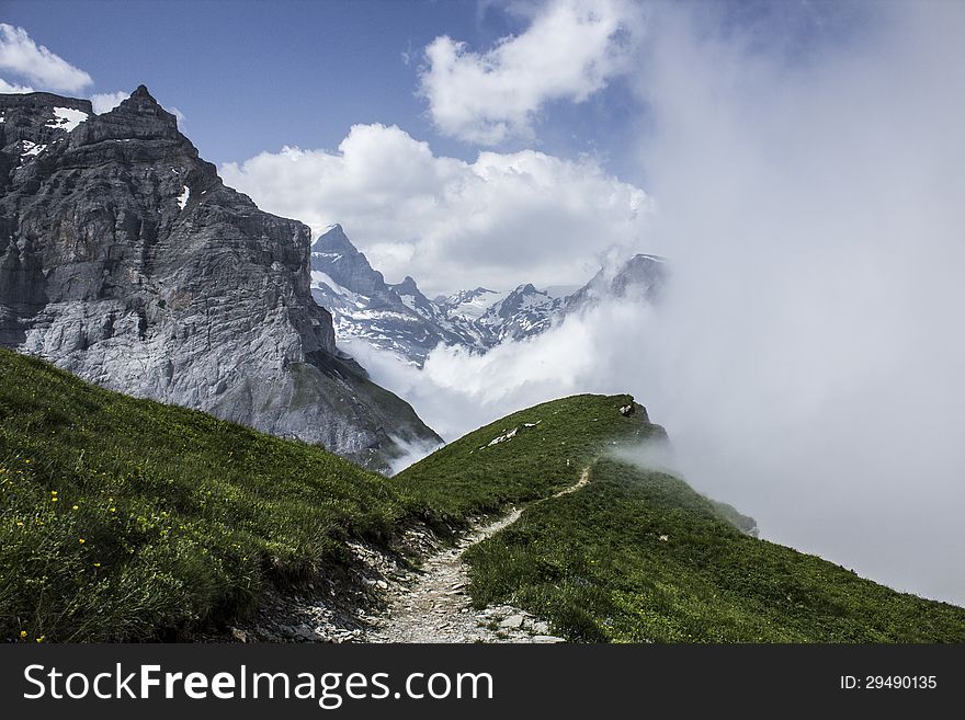 Hiking path leading to clouds