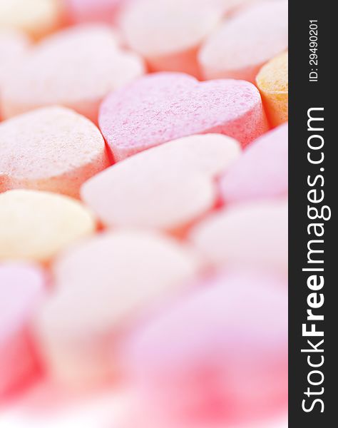 Sweet hearts shaped pink and orange Sugar Pills. Soft Focus. Sweet hearts shaped pink and orange Sugar Pills. Soft Focus.