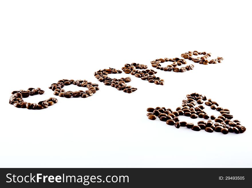 The word coffee in coffee beans with a heart of coffee beans. The word coffee in coffee beans with a heart of coffee beans