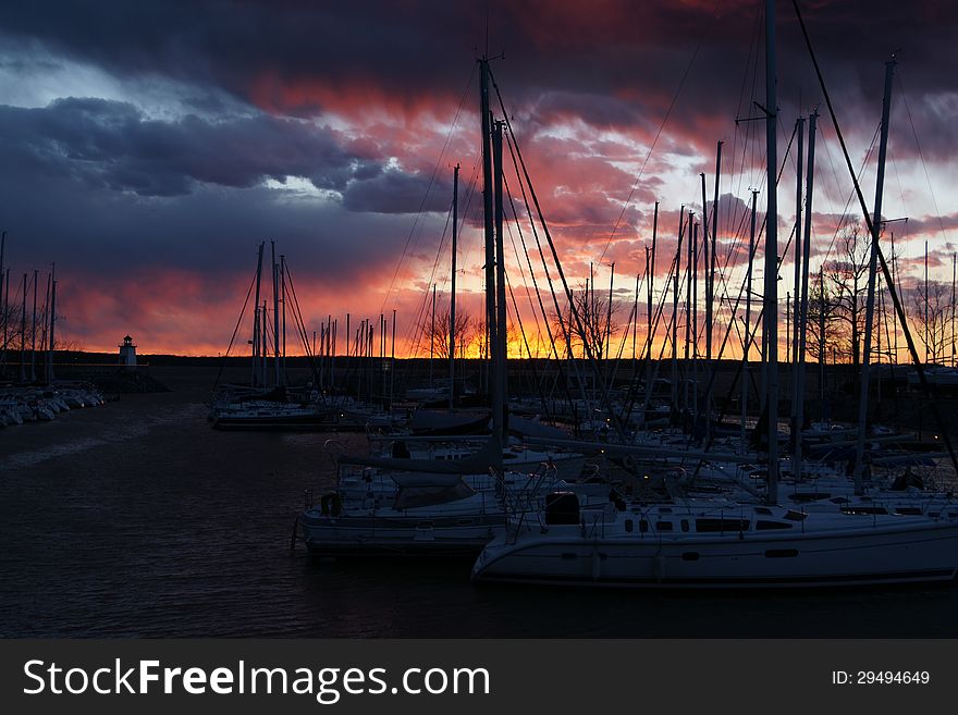 The photo was taken at a marina on Kentucky Lake just as the evening sun was setting lighting up the clouds. The photo was taken at a marina on Kentucky Lake just as the evening sun was setting lighting up the clouds.