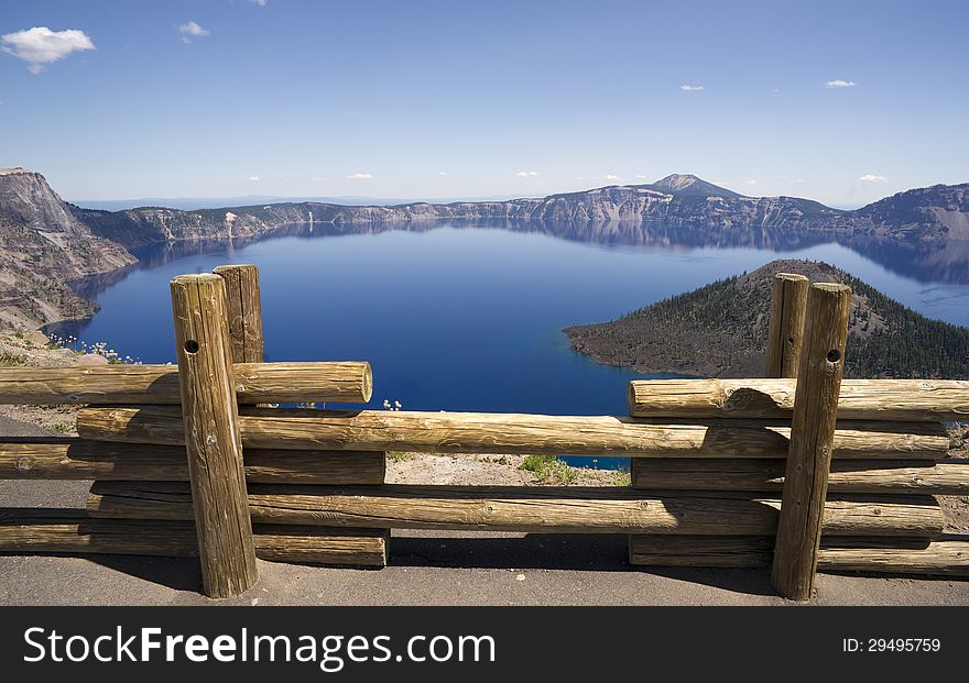 A fence keeps folks safe at Crater Lake National Park. A fence keeps folks safe at Crater Lake National Park