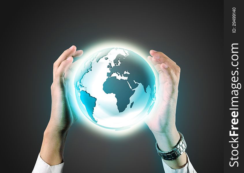 Business man holding a earth globe in his hands in grey background