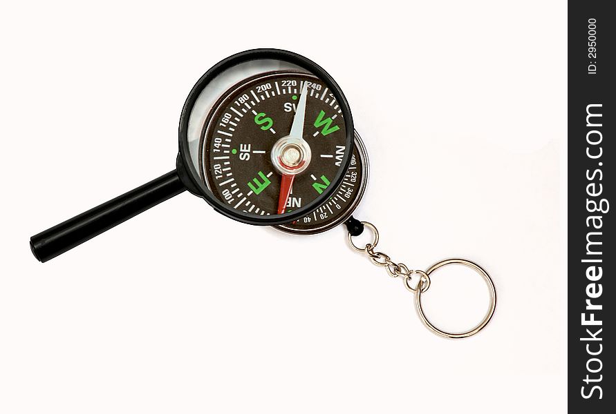 An image of magnifier and compass on white background