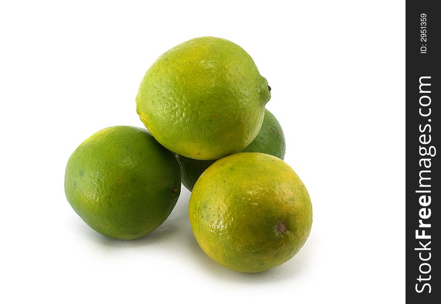 Four green limes on the white background. Four green limes on the white background