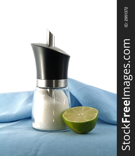 Half of green lime and sugar dispenser