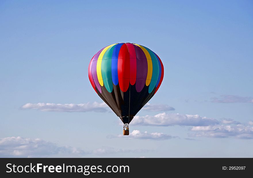 Hot Air Balloon Against a Cloudy Blue Sky