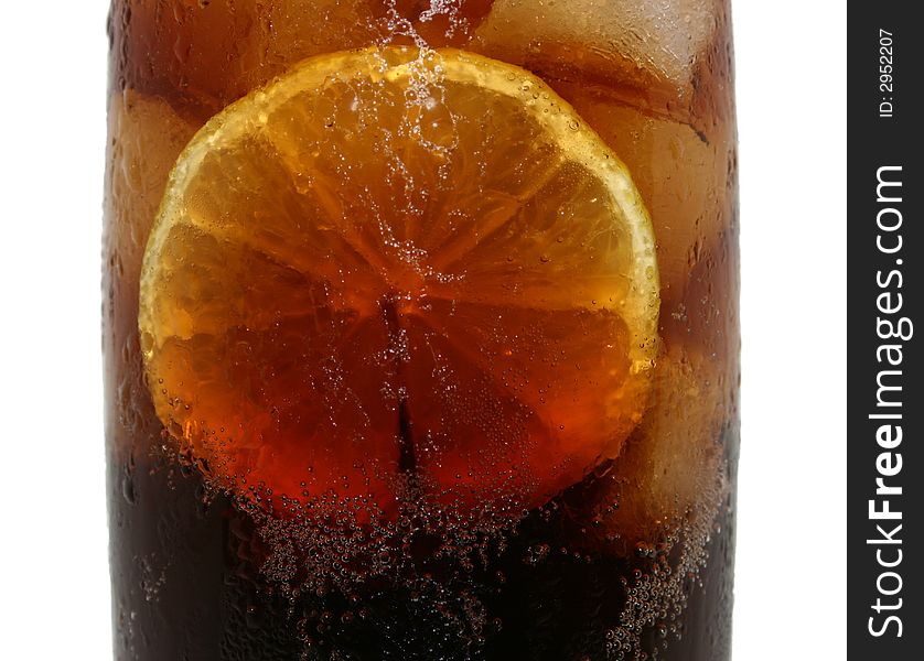 A slice of lemon in a cola. A slice of lemon in a cola