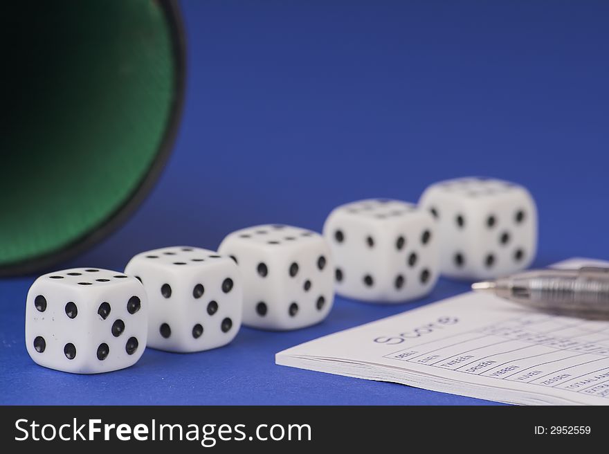 Five yamb dice with scoreboard on a red blue background