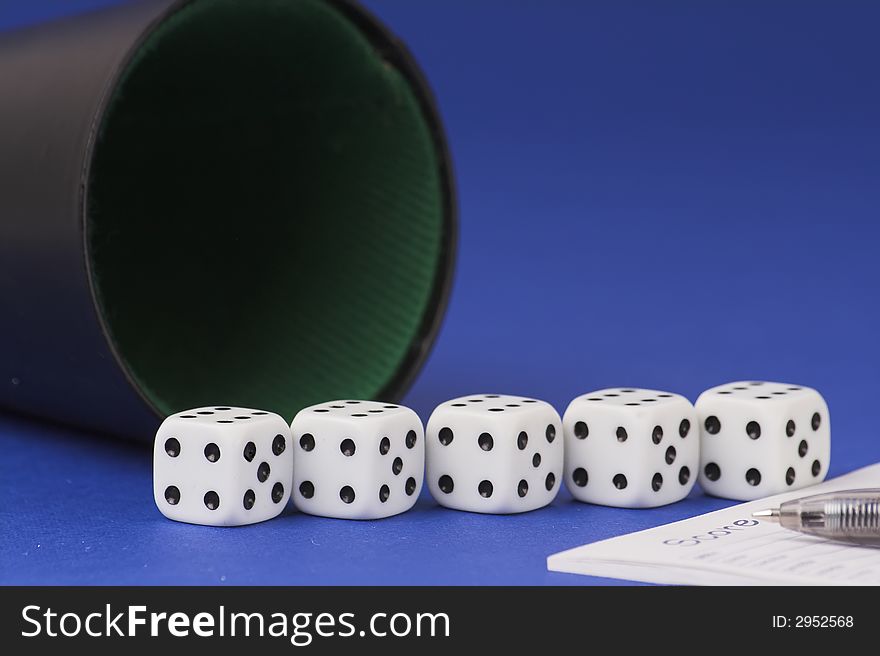 Five yamb dice with scoreboard on a red blue background