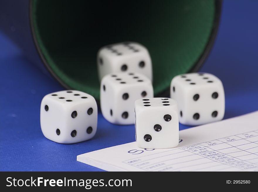 Five yamb dice with scoreboard on a red blue background