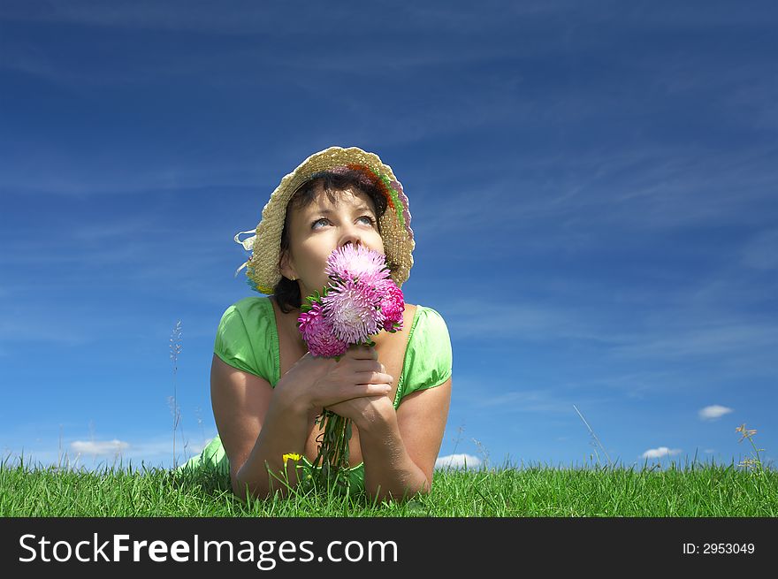 Portrait of nice cute woman with flowers in summer environment. Portrait of nice cute woman with flowers in summer environment