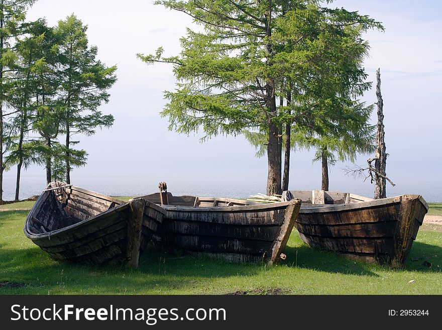 Old wooden fishing boats on the Baikal lakeside