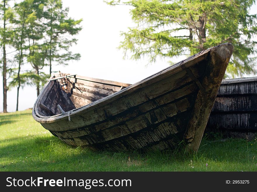 Old wooden fishing boat on the Baikal lakeside