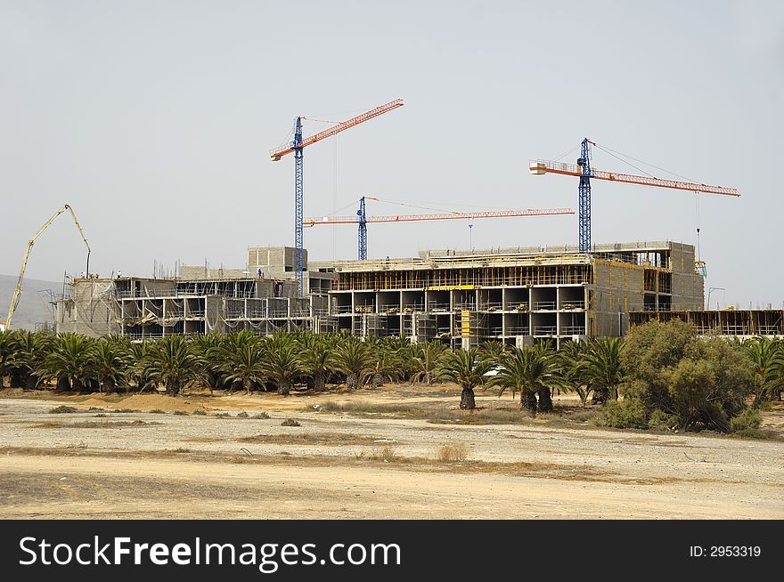 Workers are building a hotel. Workers are building a hotel.