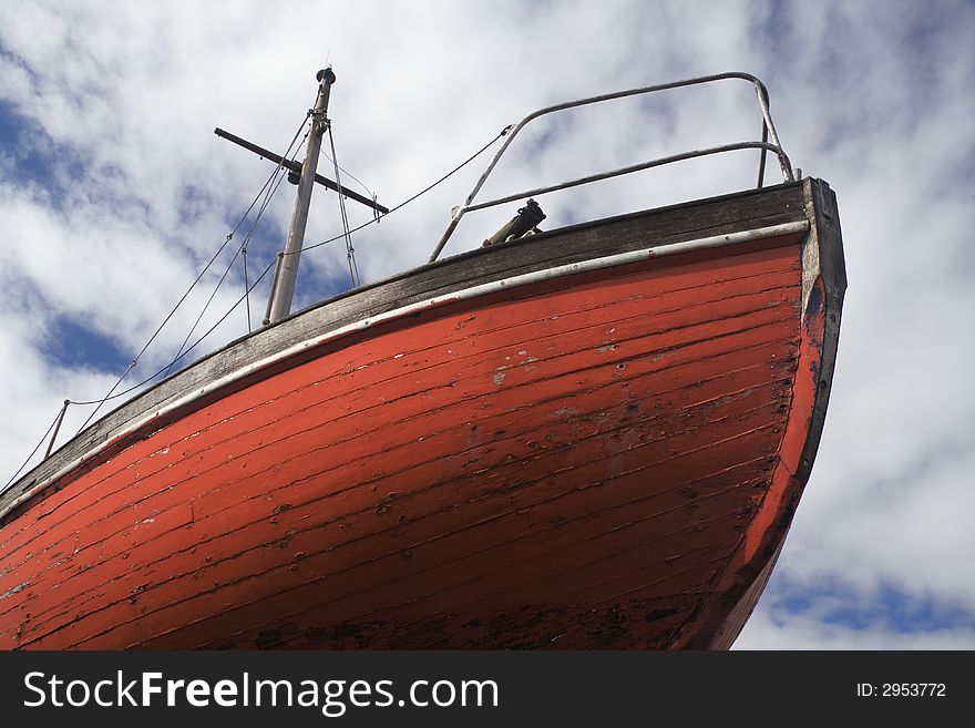 Bow of boat in dry dock showing hull planks. Bow of boat in dry dock showing hull planks