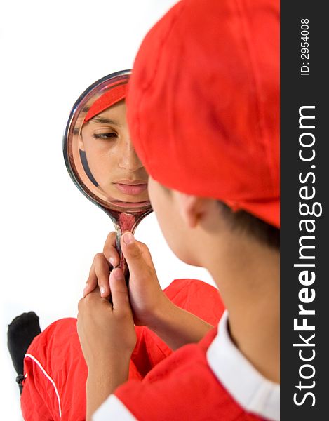 Young boy holding a mirror