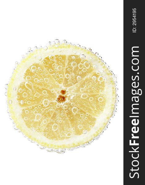 Lime slice on a bright white background whit water bubbles. Lime slice on a bright white background whit water bubbles