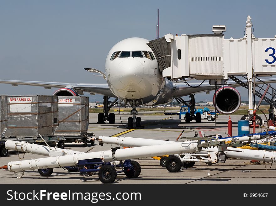 Aircraft on the ground, getting loaded