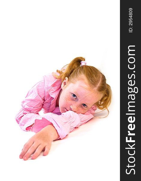 Young girl laying on floor watching