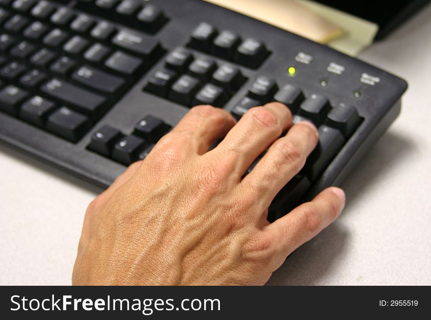 A businessman types on keyboard. A businessman types on keyboard