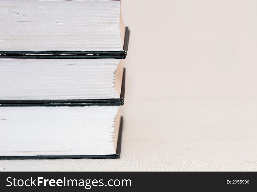 Stack of hardcover books isolated on white