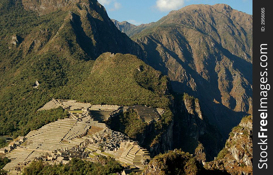 Ruins of IncaÂ´s lost city Machu Picchu imbeeded in rough mountainscape. Ruins of IncaÂ´s lost city Machu Picchu imbeeded in rough mountainscape