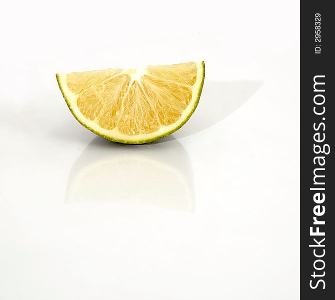 Piece of an orange isolated over white background. Piece of an orange isolated over white background