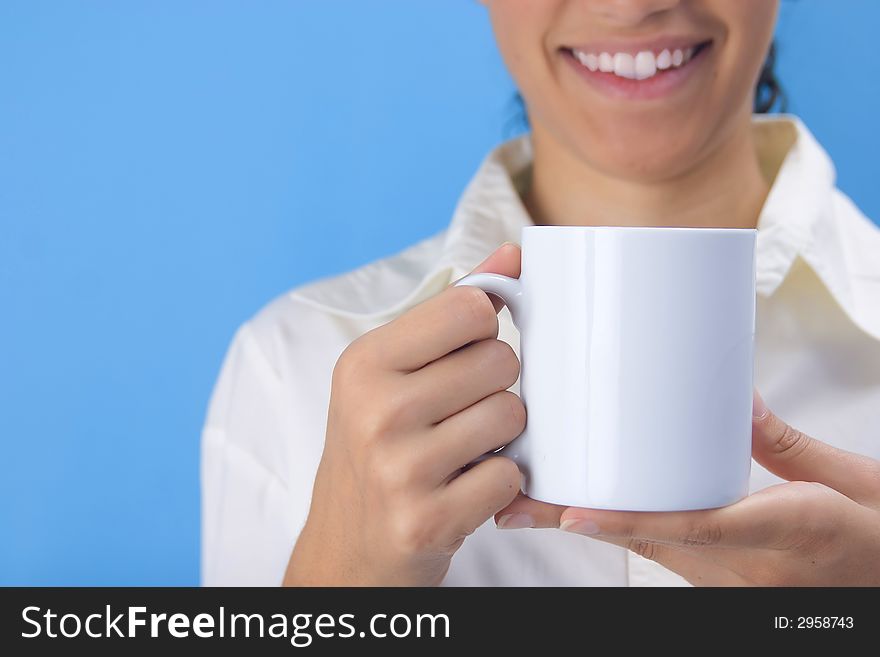 Young girl holding cup on blue background