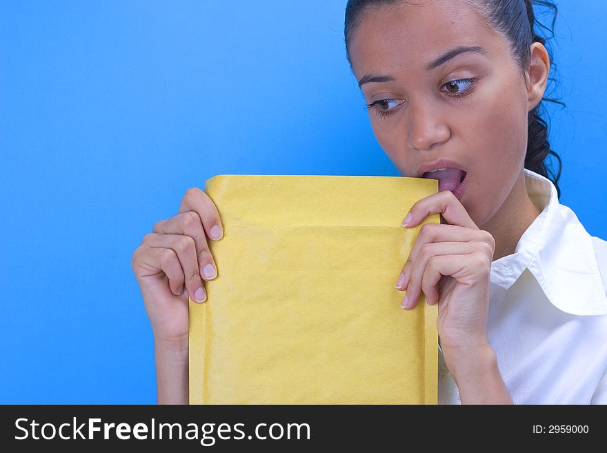 Beautiful girl holding envelope in her hands. Beautiful girl holding envelope in her hands