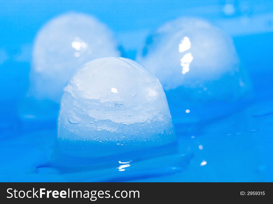 Ice cubes on a blue background