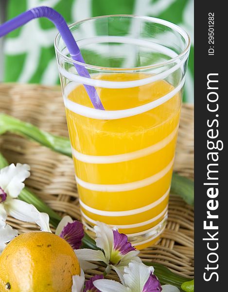 Glass of fresh orange juice with colorful background. Glass of fresh orange juice with colorful background
