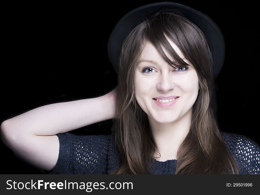 Girl in black with stylish black hat