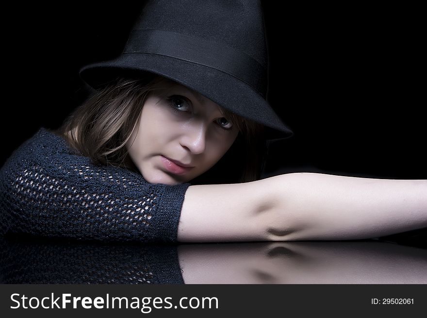 Luxury glamour elegant adult girl in black dress with stylish black hat. Luxury glamour elegant adult girl in black dress with stylish black hat