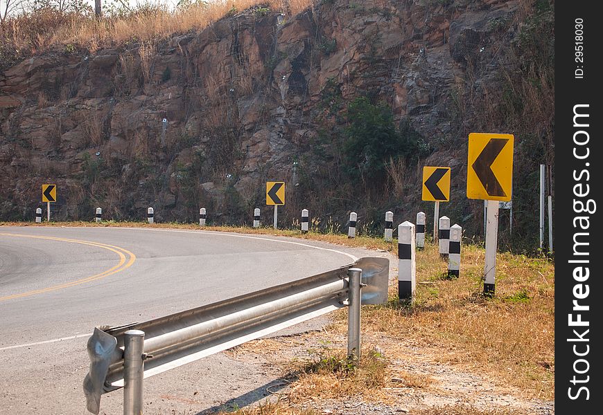 Yellow traffic sign, turn left.