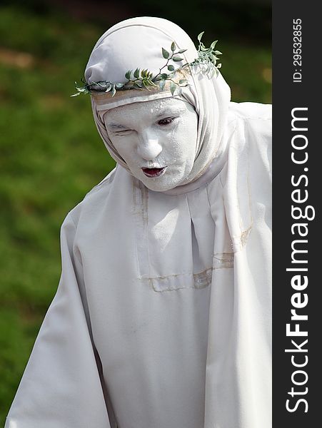 Person In Roman Toga Costume At Carnival Party