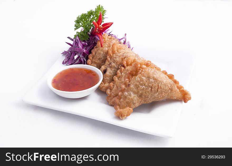 Thai popular entree,curry puff and sweet chili sauce. Thai popular entree,curry puff and sweet chili sauce.