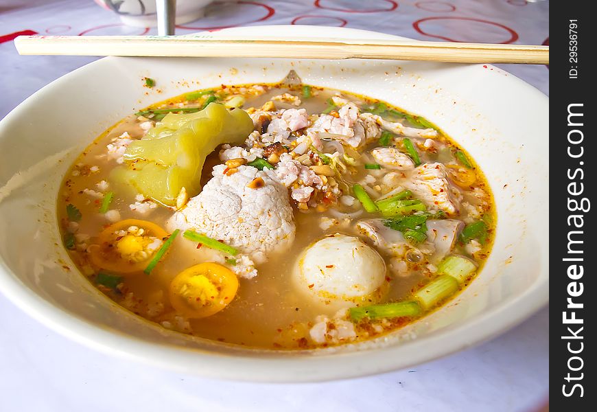 Thai noodle soup with pork and fish ball