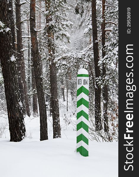 Sign (forest area column) in the winter forest. Sign (forest area column) in the winter forest