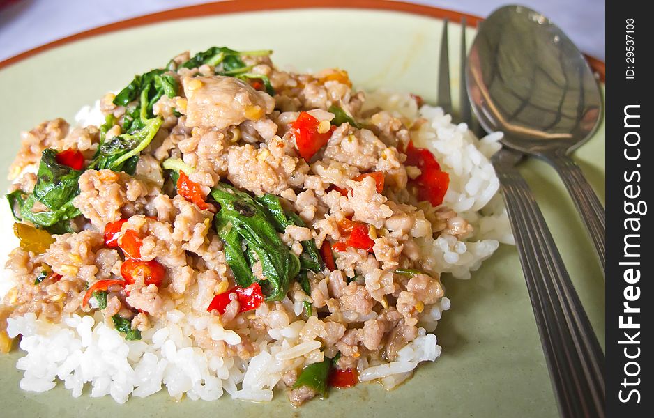 Rice topped with Stir fried pork and basil