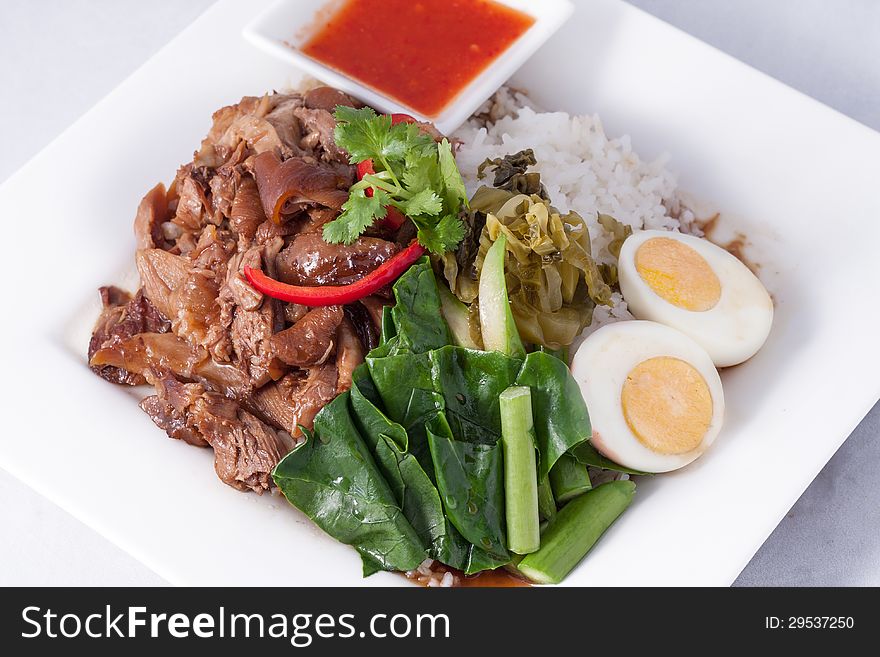 Pork stew with rice and vegetable,Thai fast food