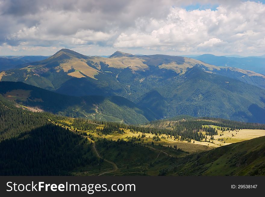 Summer mountain landscape with a cloudy sky. Summer mountain landscape with a cloudy sky